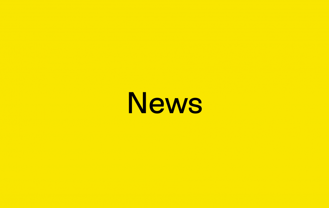 News in black letters on yellow background